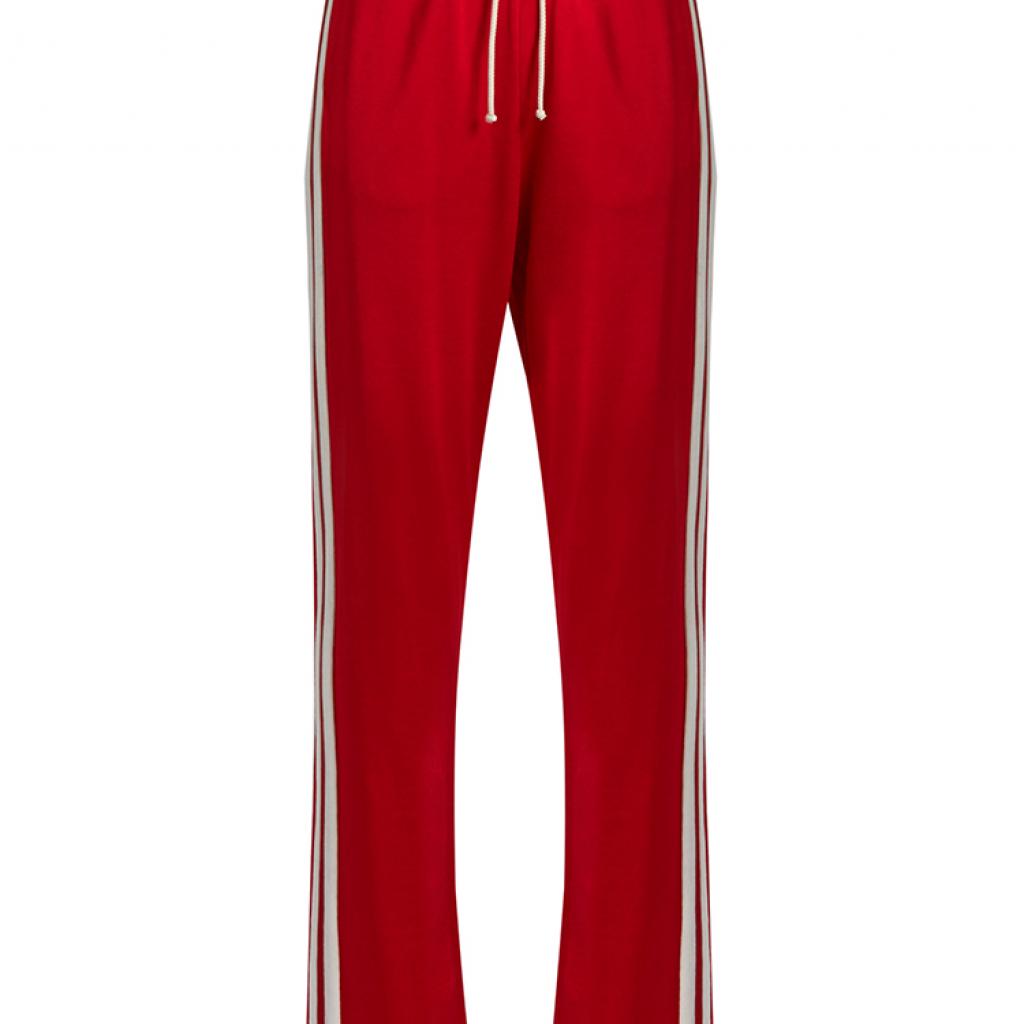 Pantalon rouge à bandes blanches, MM6 Margiela, 284 € sur <a href="http://www.matchesfashion.com/intl/" target="_blank">matchesfashion.com</a>